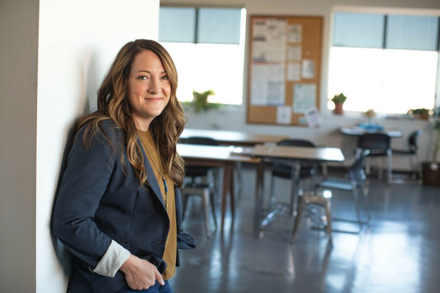 teacher standing by classroom